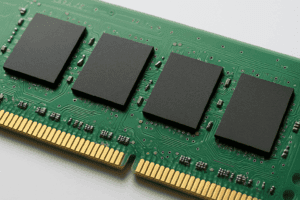Close-up view of a green computer memory module showing circuits and chips