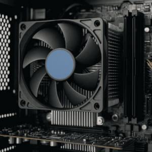 Close-up of CPU air cooling system with fan and aluminum heat sink inside a desktop computer